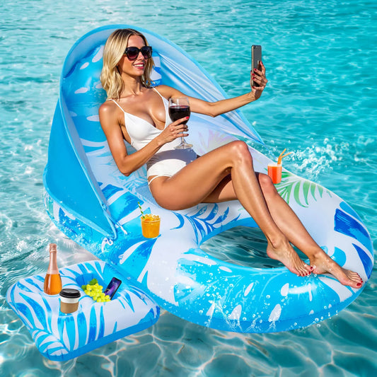 Woman taking a selfie while relaxing on a luxurious inflatable pool lounger float with a sun canopy and a glass of wine.