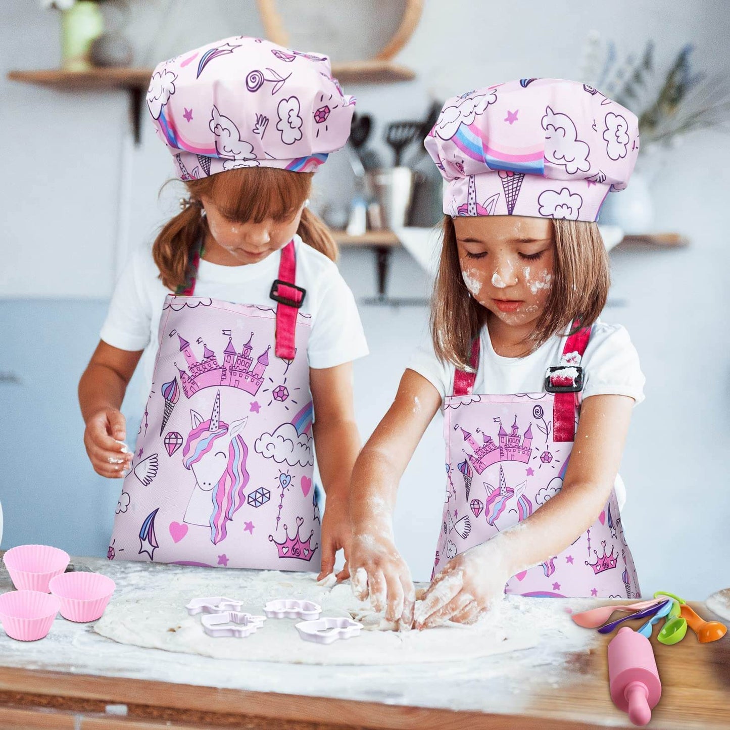 Two girls playing with Gleamkid 27 piece kids cooking and baking set, enjoying a baking activity with unicorn-themed items.