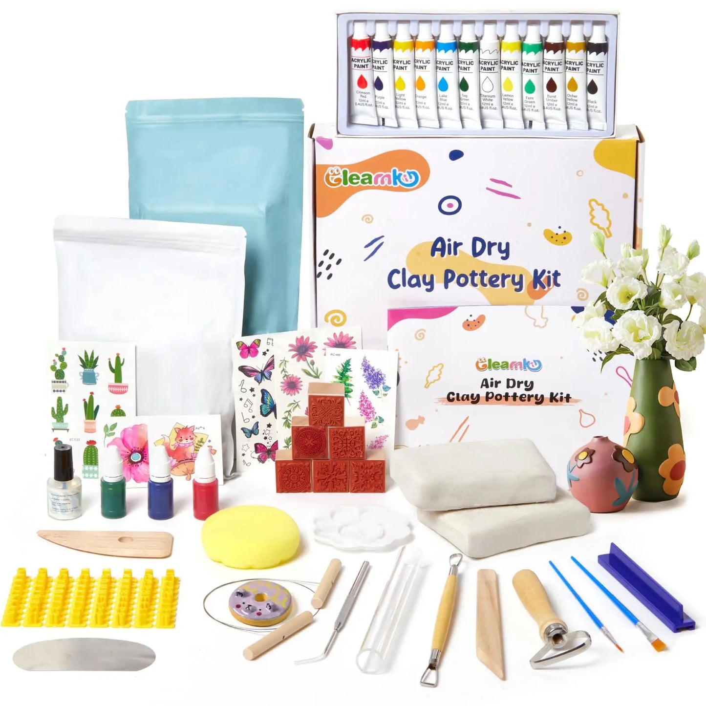 The complete Gleamkid air dry clay pottery kit with all contents, including clay, tools, paints, and stamps.