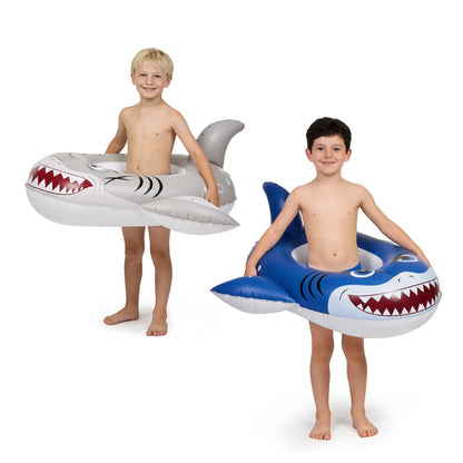 Two happy boys holding lightweight blue and silver shark inflatable pool toys.