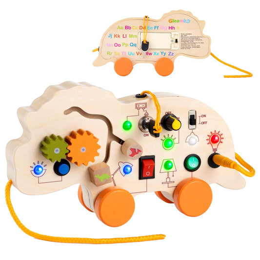 Wooden dinosaur busy board showing the front with LED lights and switches, and the back with the alphabet for learning.
