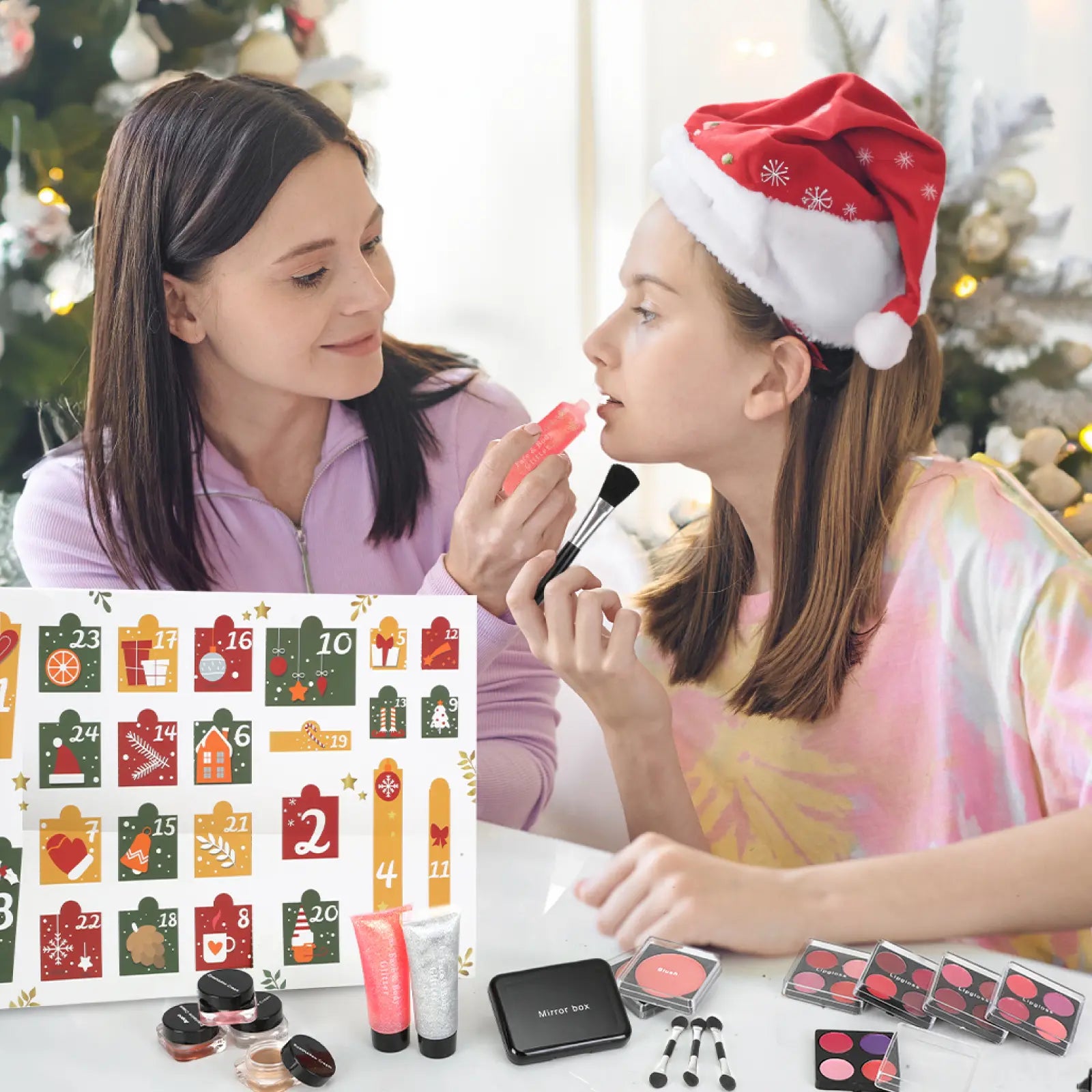 Mother and teen daughter apply lip gloss from the Gleamkid Christmas makeup advent calendar 2025, a perfect teen gift.