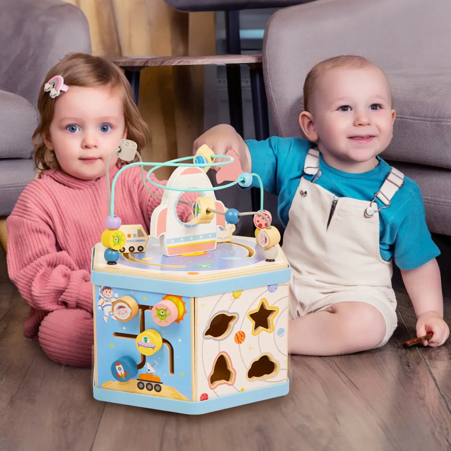 Two toddlers engage with gleamkid wooden space activity cube.
